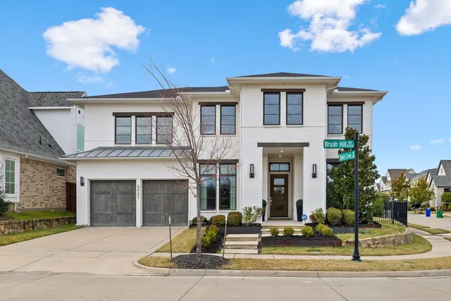 Contemporary white home on a corner lot in Carrollton