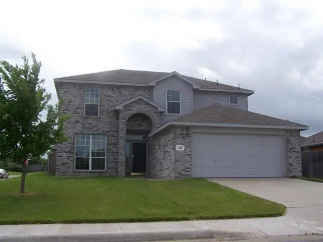 Two-story stone home in Farmersville