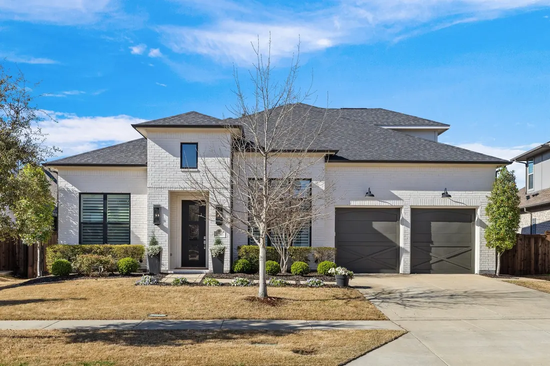 Modern white two-story home in Frisco