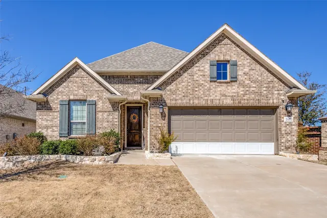 Single-story brick and stone home in McKinney